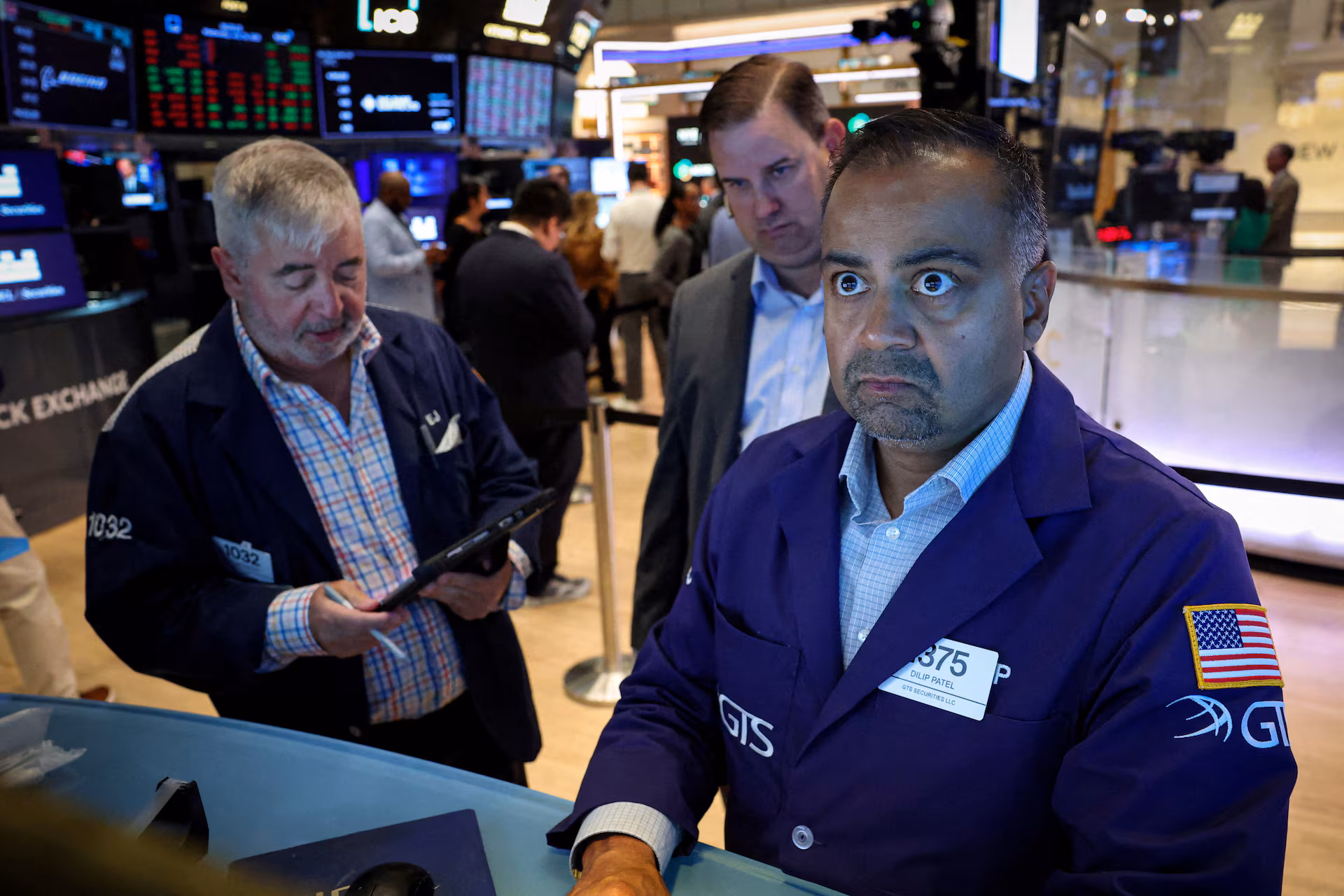 Traders work on the floor of the NYSE in New York