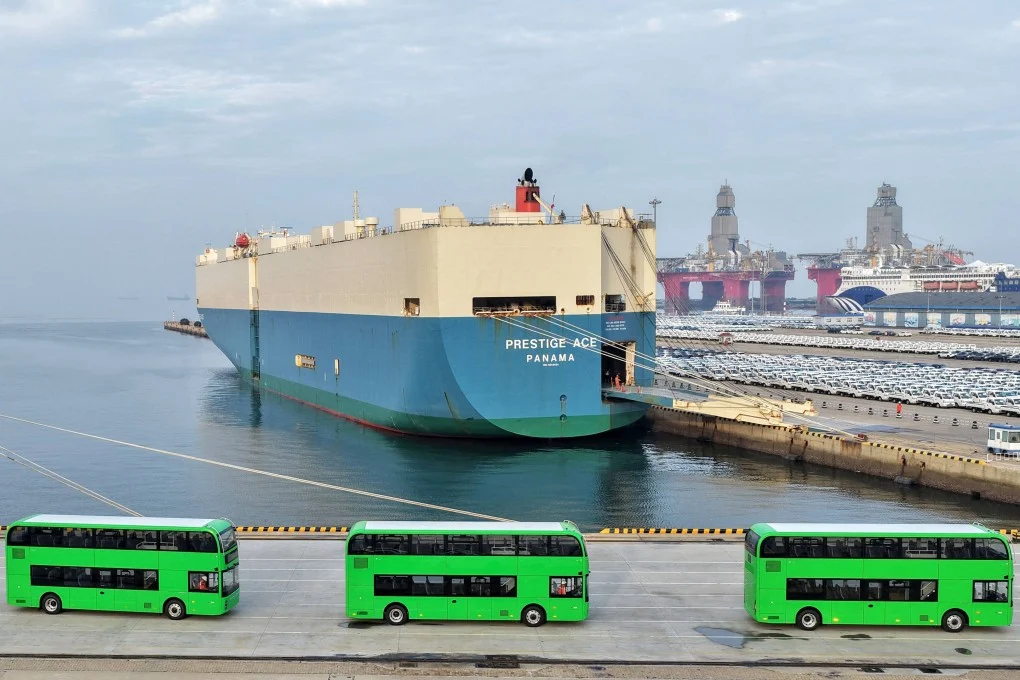 Yutong electric double-decker buses for export to the UK are driven onto a car carrier at Yantai Port in Shandong province on July 27. Photo: AFP