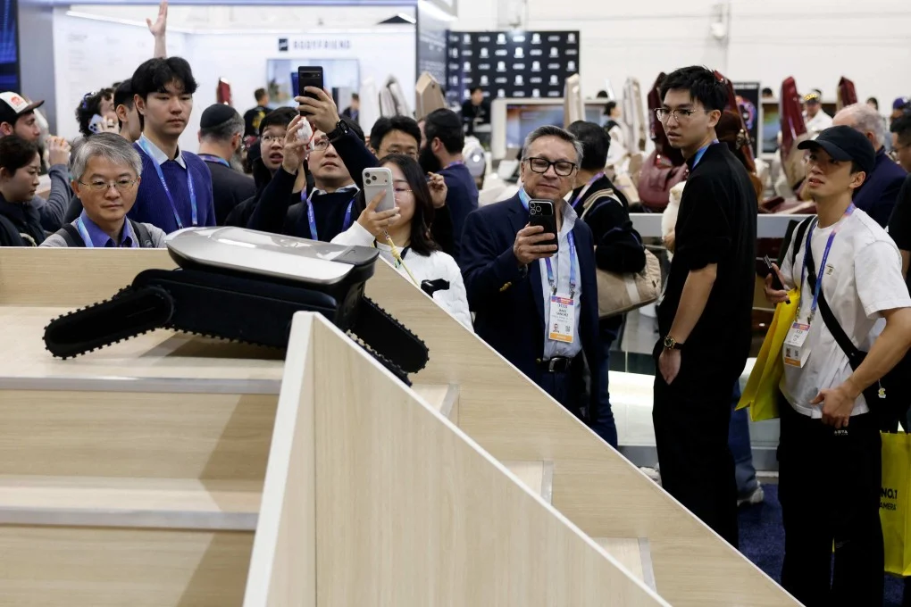 People watch as a Cyber X robot moves up and down stairs at a Dreame booth during the annual Consumer Electronics Show in Las Vegas, Nevada, in January. Photo: AFP