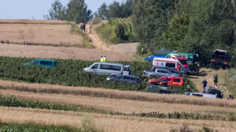 Reuters Emergency services work at the site where an unidentified flying object, believed to be a Russian cruise missile, as Ukraine's foreign minister said on Thursday, fell after violating Polish airspace