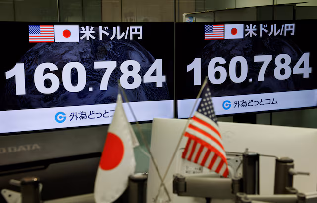 Monitors display the current Japanese Yen exchange rate against the U.S. dollar at a dealing room of the foreign exchange trading company Gaitame.com in Tokyo