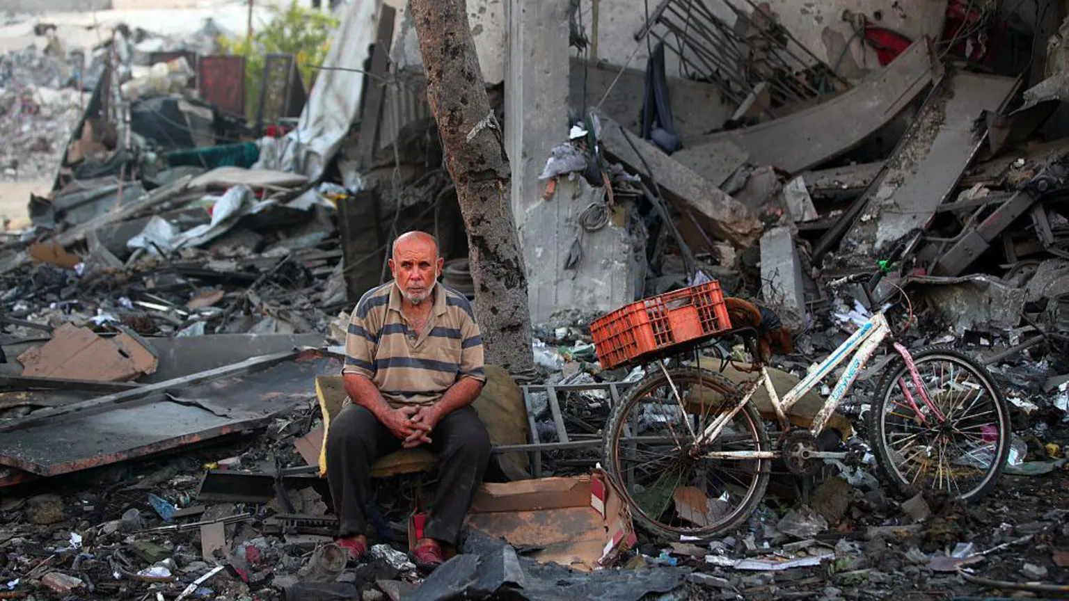 Getty A Palestinian man rests amid debris at the site of an Israeli strike on a house in Gaza City, on July 30, 2026.