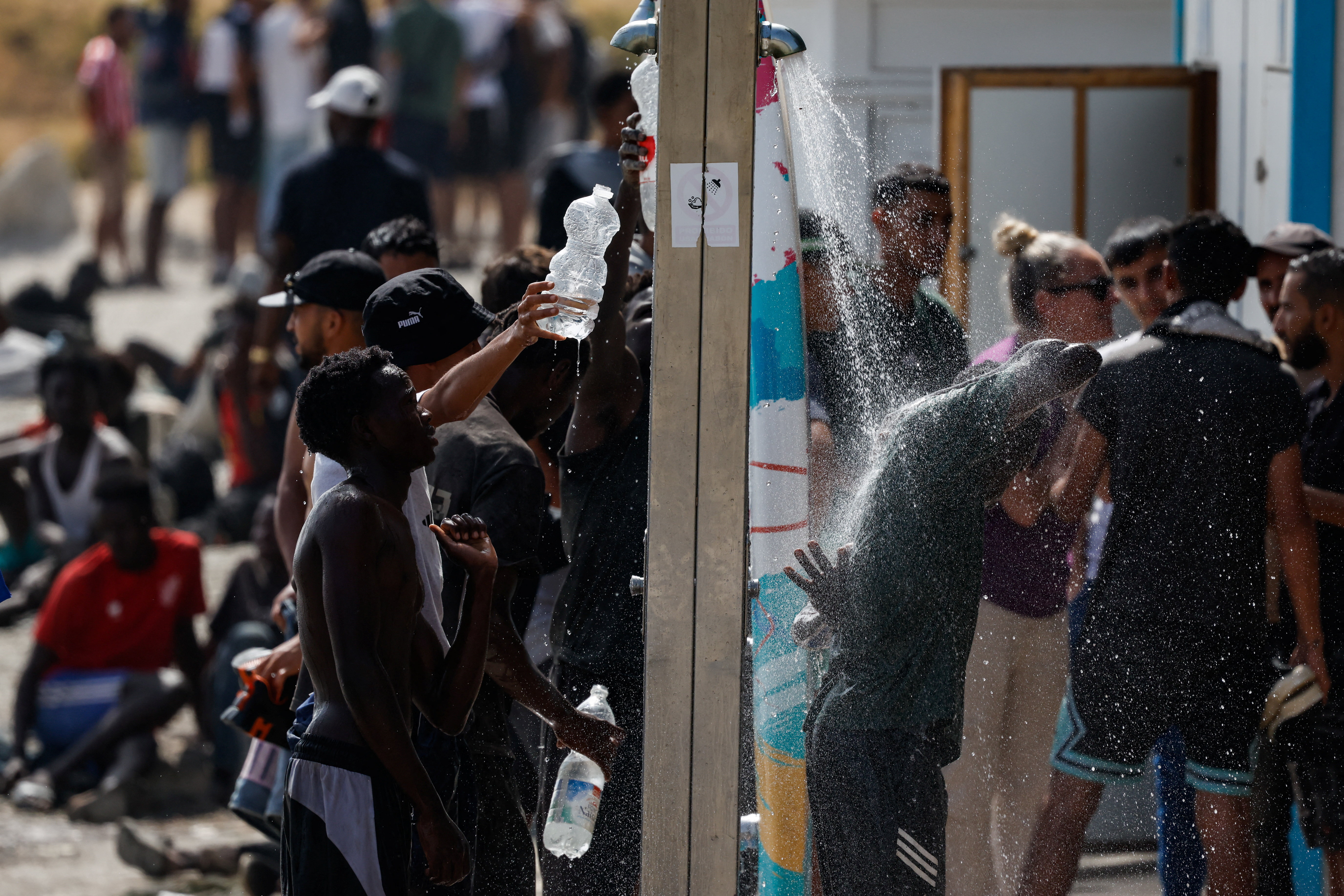 Mass crossings of migrants on foot and by sea from Morocco into Spanish territory, in Ceuta