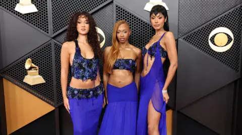 Getty Images Stella Quaresma, Renée Downer and Jorja Douglas of Flo attend the 68th GRAMMY Awards at Crypto.com Arena on February 01, 2026 in Los Angeles, California.