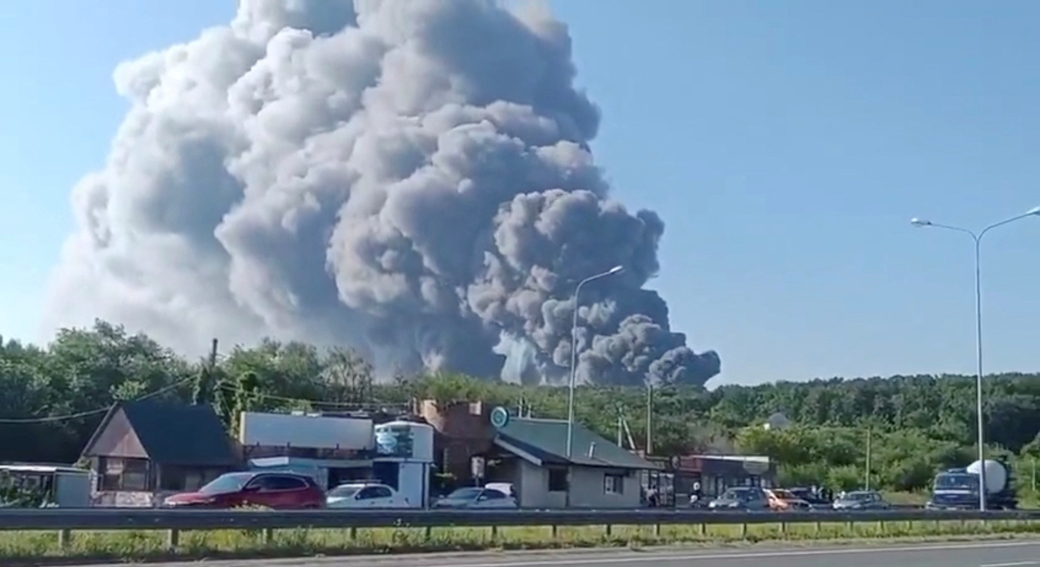 Smoke rises after a Ukrainian drone attack on a Wildberries warehouse, in Novosemeykino