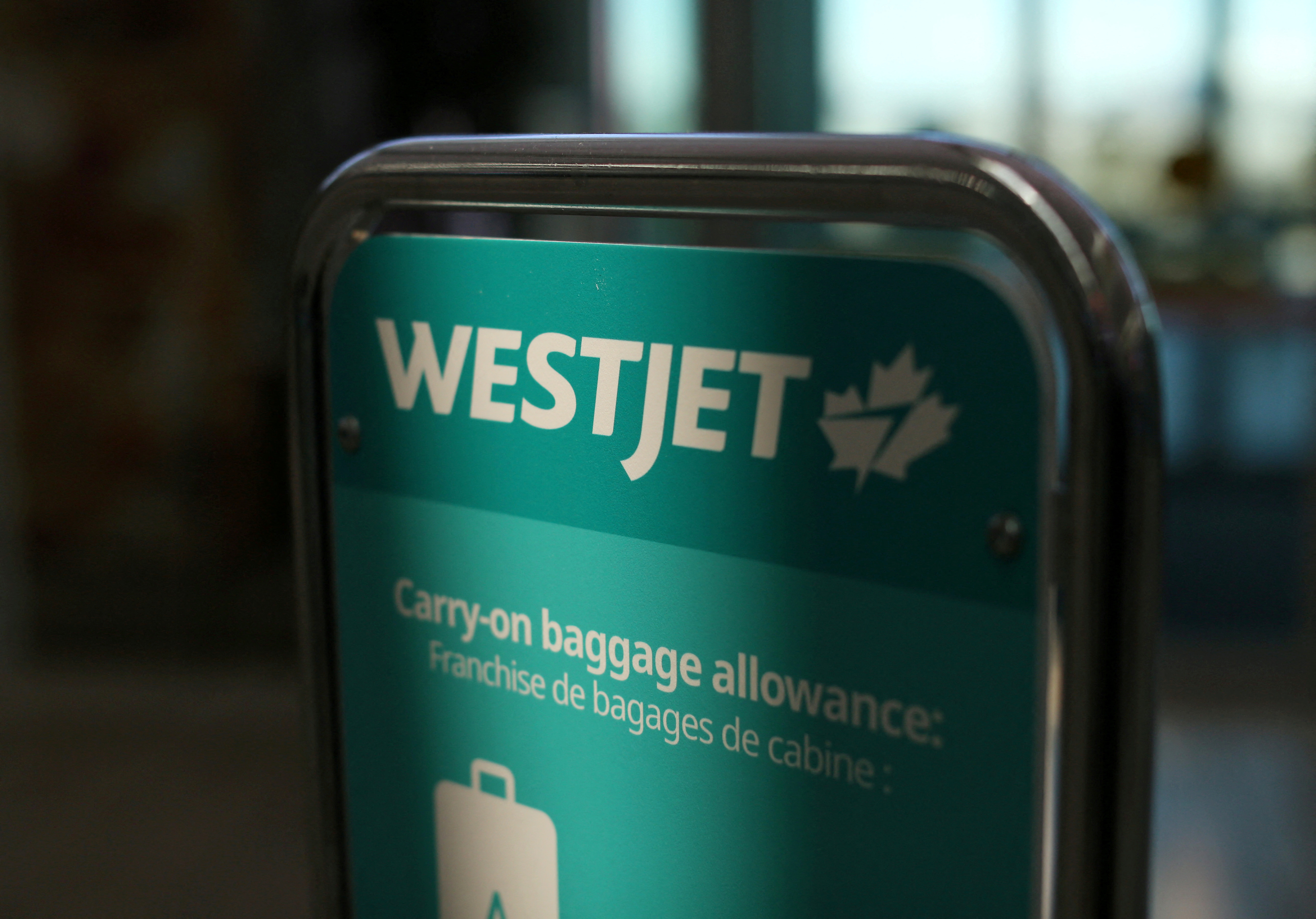 WestJet airline signage is pictured at Vancouver's international airport in Richmond,