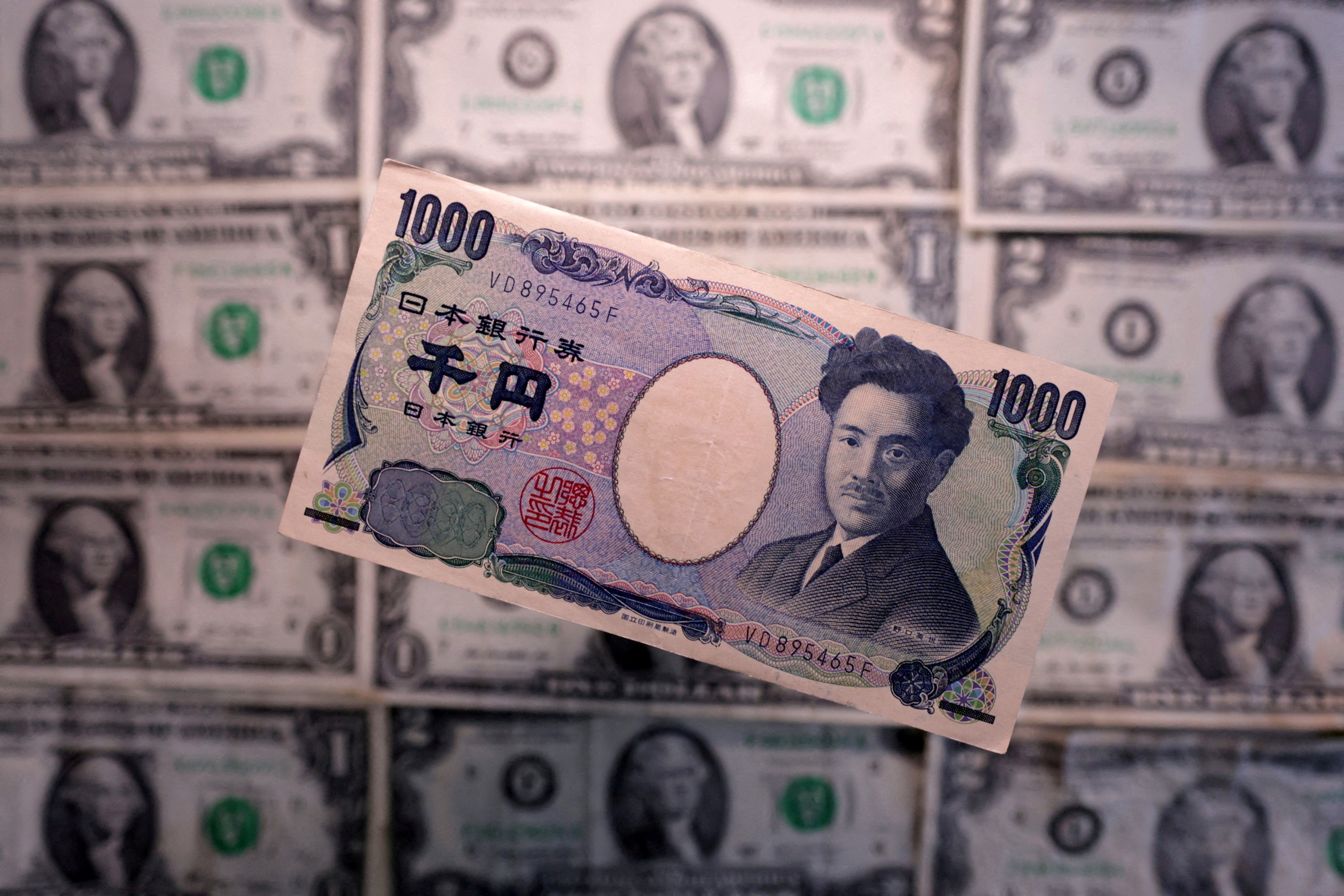 Illustration shows Yen and U.S. dollar banknotes