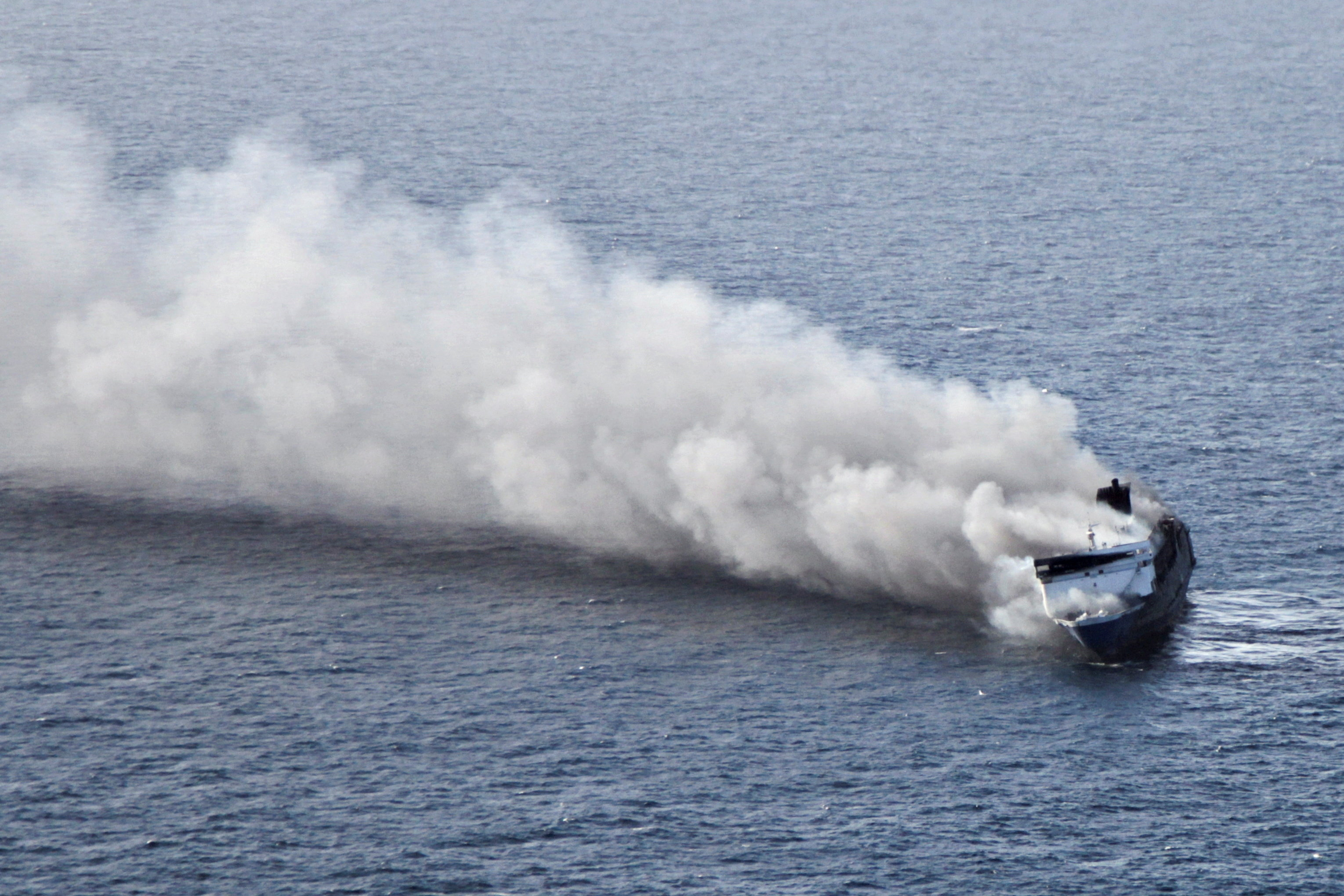 Plumes of smoke rise from a Mutiara Sentosa 2 ferry which caught fire off Indonesia's Madura island in East Java province