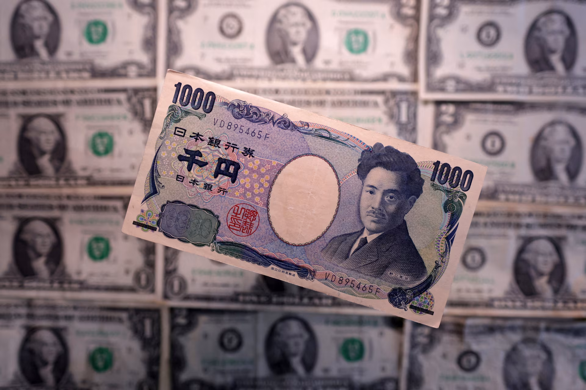 Illustration shows Yen and U.S. dollar banknotes