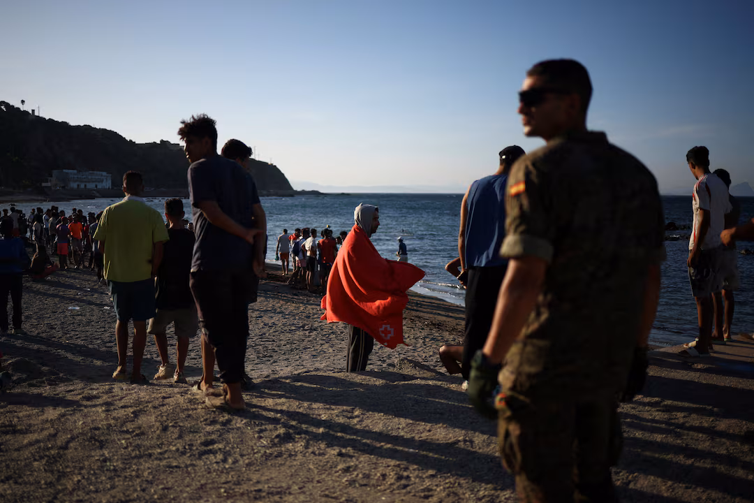 Mass crossings of migrants on foot and by sea from Morocco into Spanish territory, in Ceuta