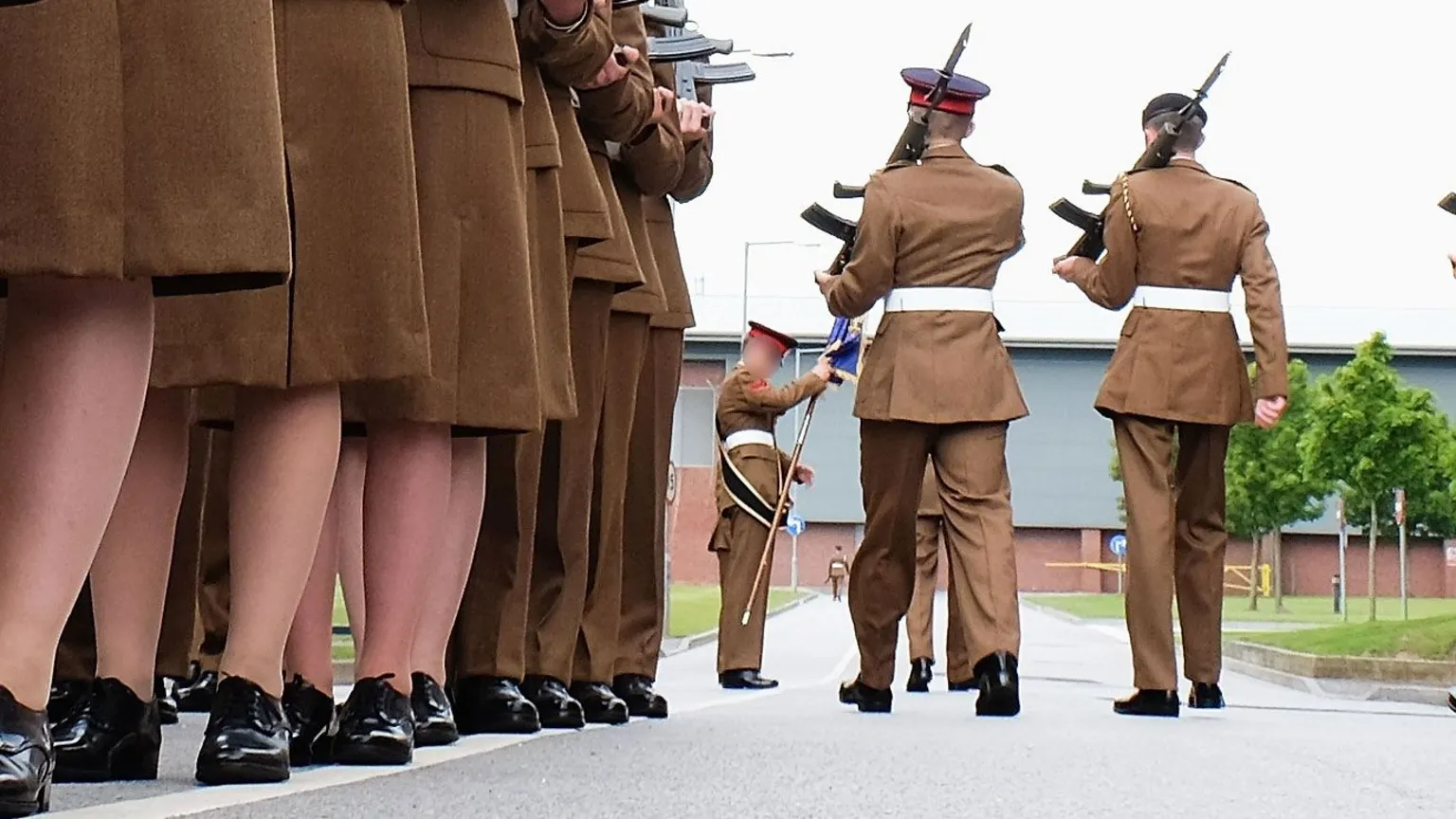 Getty Images A stock image shows the feet of junior soldiers lining up with guns as they prepare to march ahead of their graduation parade at the Army Foundation College in 2015.
